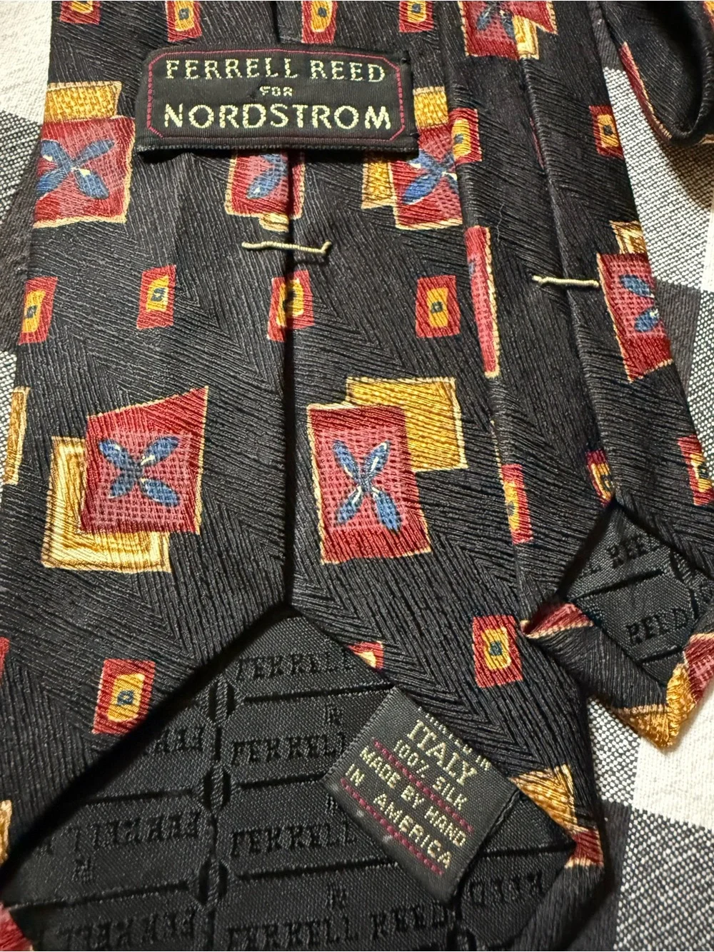 Black Tie with Red and Gold Geometric Motif